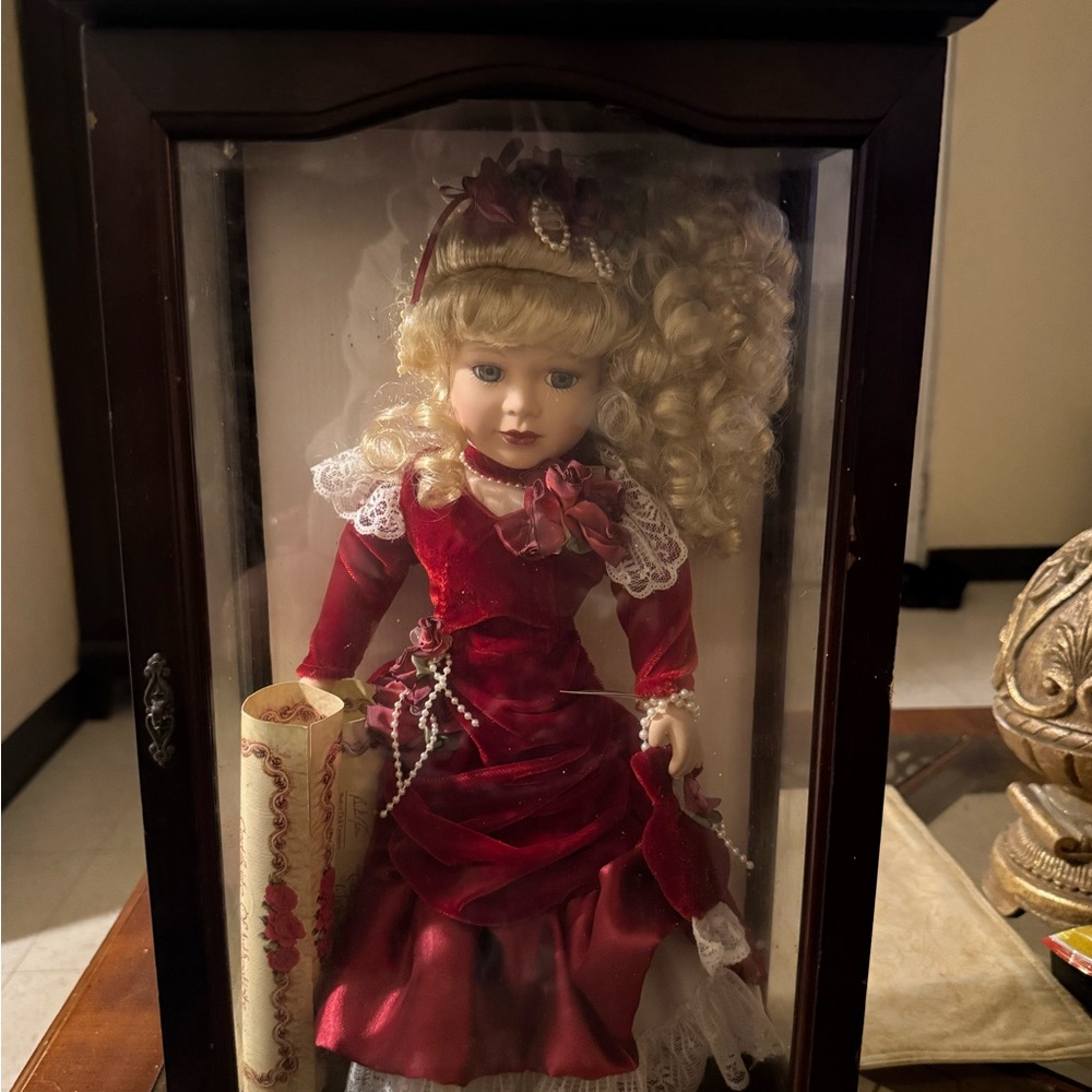 Elegant Red Porcelain Doll in Display Case